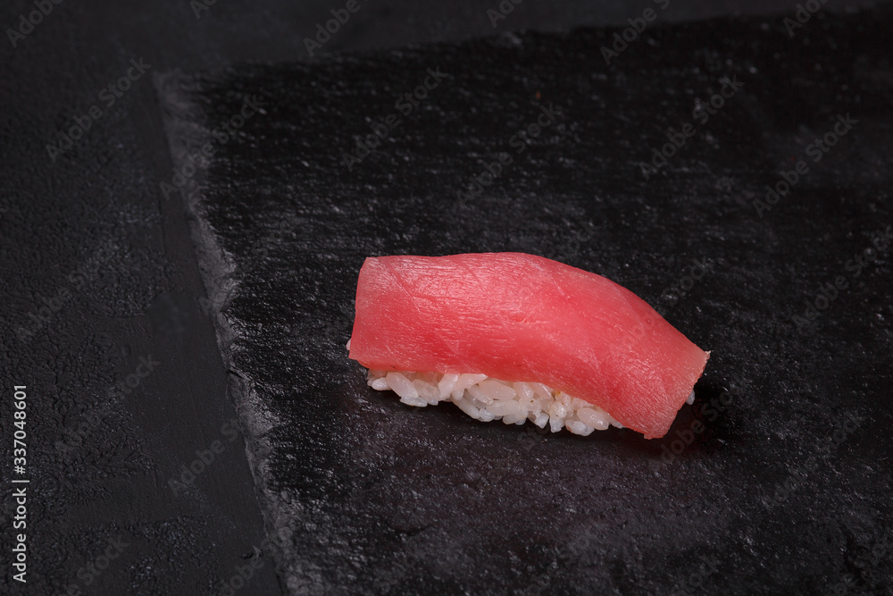 Tuna sushi on black background Tuna sushi on black background