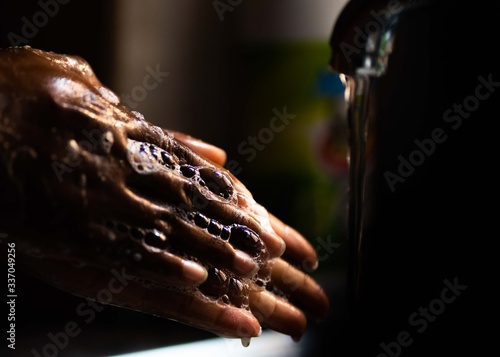 Washing hands with tap water