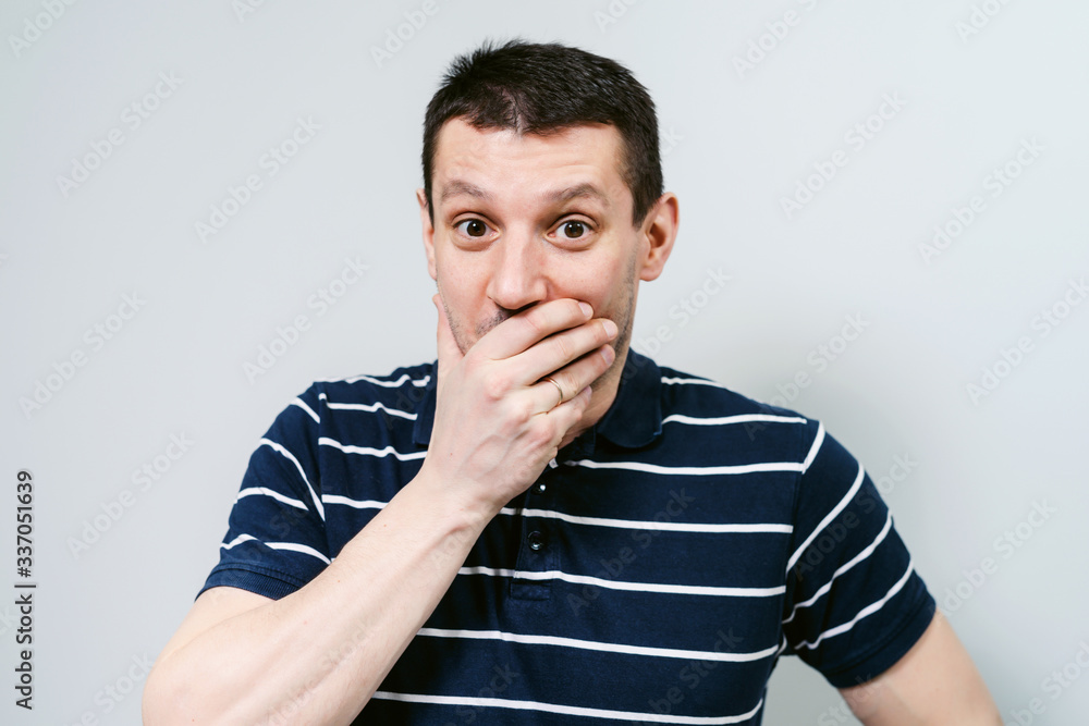 Wonderment. The man is surprised and shocked. Young guy shows different emotions. Wonderment. The man is surprised and shocked. Young guy shows different emotions.