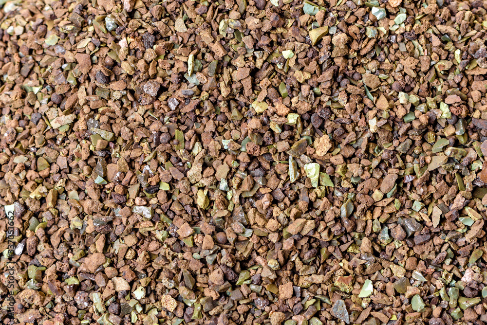 Crushed stone abstract textured background. The rough texture of the stone. Building material background Crushed stone abstract textured background. The rough texture of the stone. Building material background