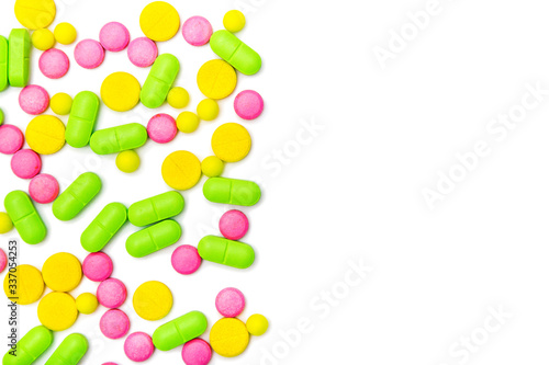 ndful of tablets and pills in hand isolated on white