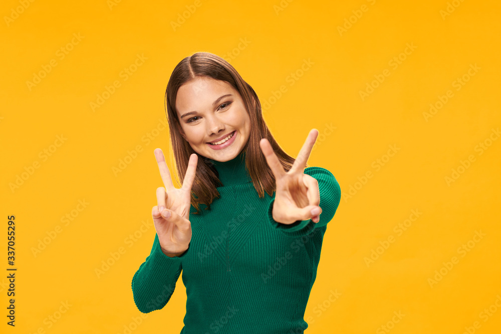 young woman showing thumbs up young woman showing thumbs up