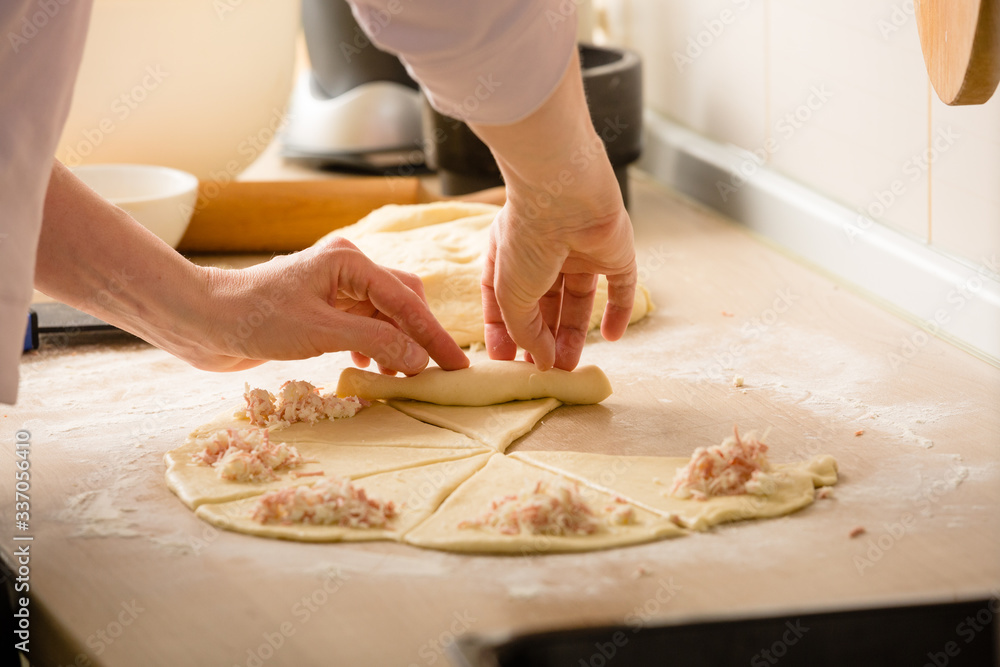 woman preparing basic dough rolls in kitchen woman preparing basic dough rolls in kitchen