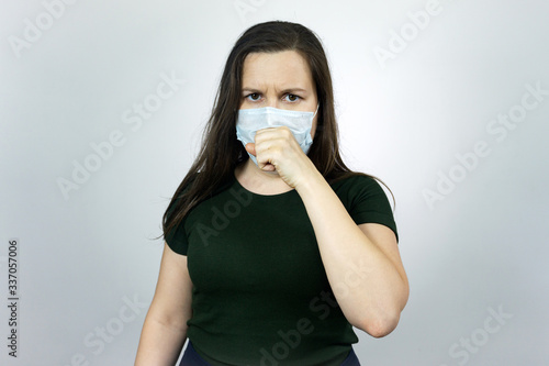 Woman cough with virus protection mask against pandemic of coronavirus COVID-19