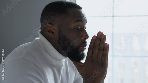Wallpaper Mural Concerned afro-american man praying God, asking for support and blessing, faith Torontodigital.ca