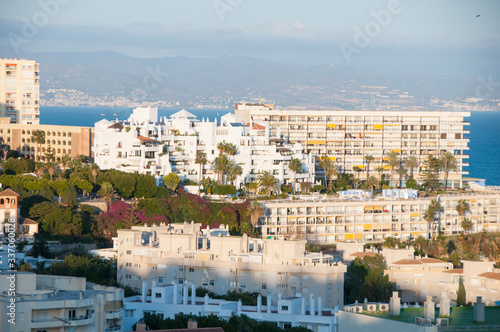 White buildings on the Mediterranean coast. Spanish tourist town on a hill near the sea. Mediterranean architecture.
