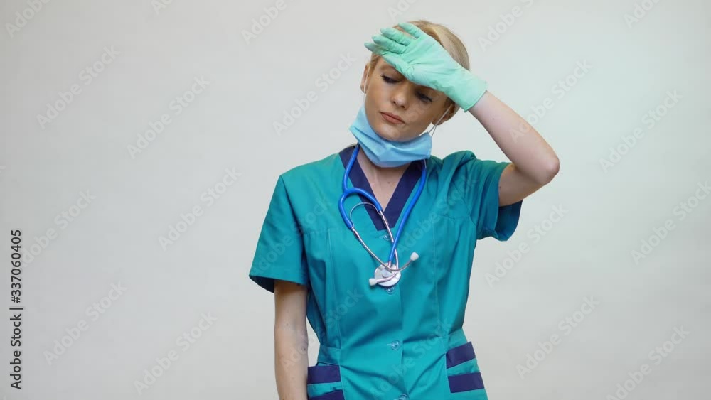 medical doctor nurse woman wearing protective mask and rubber or latex gloves - tired and stressed medical doctor nurse woman wearing protective mask and rubber or latex gloves - tired and stressed