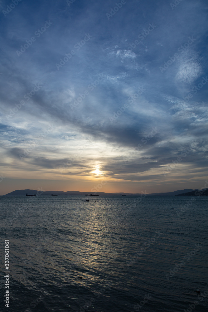 Sunset sea ship horizon landscape. sea-shore under quarantine with no people. COVID-19. waves Beautiful dawn sunrise at sea. Seascape