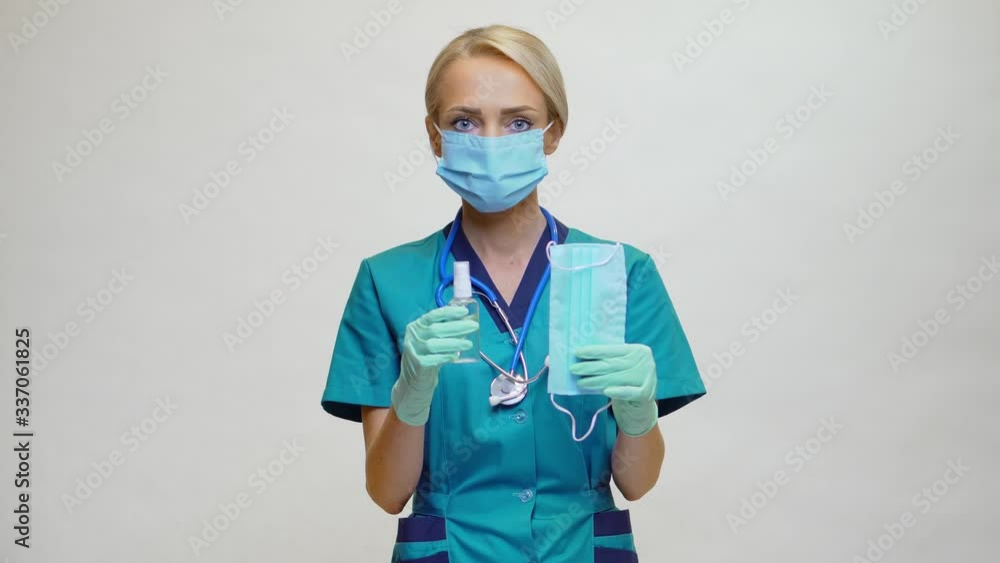 medical doctor nurse woman with stethoscope - showing protective mask and sanitizer medical doctor nurse woman with stethoscope - showing protective mask and sanitizer