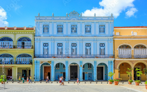 Havana Cuba View of Plaza Vieja colored houses with a sunny blue sky. © Brice