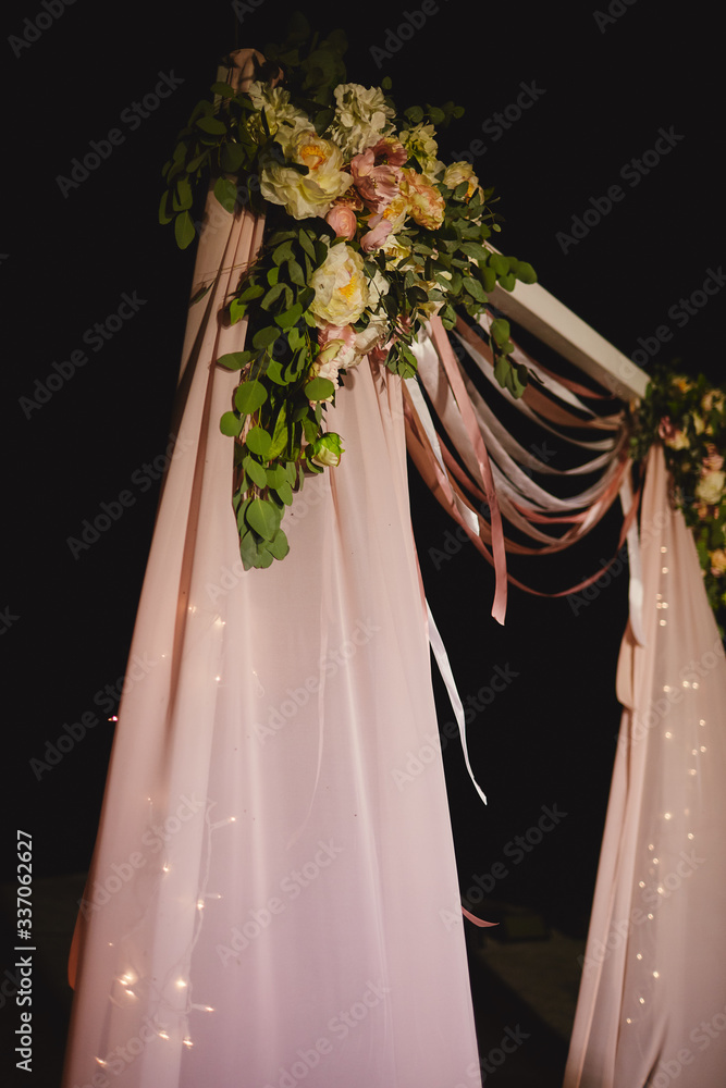 arch for the wedding ceremony, decoration cloth flowers greenery, Wedding arch with light bulb outdoors. selective focus arch for the wedding ceremony, decoration cloth flowers greenery, Wedding arch with light bulb outdoors. selective focus