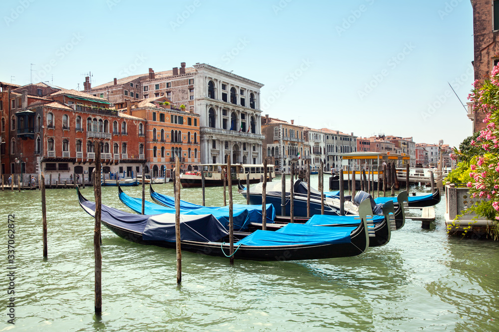 Gondolas on grand canal at S.Silvestro vaporetto stantion in Venice, Italy
