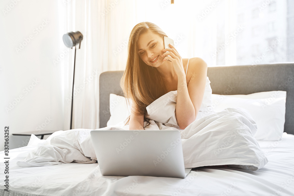 Smiling young female looking at a computer Smiling young female looking at a computer