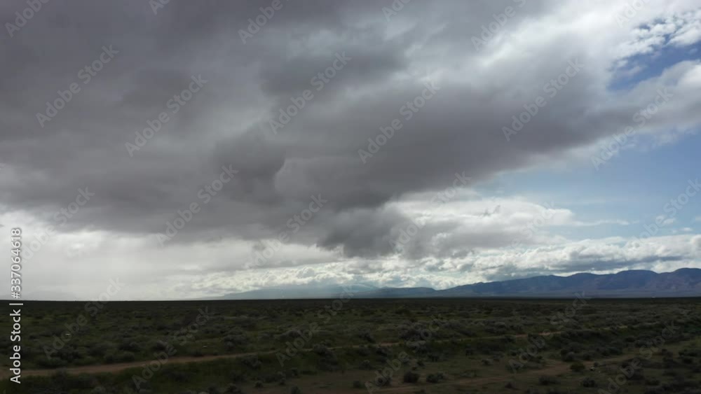 Aerial, flying low over the mojave desert on a stormy day Aerial, flying low over the mojave desert on a stormy day
