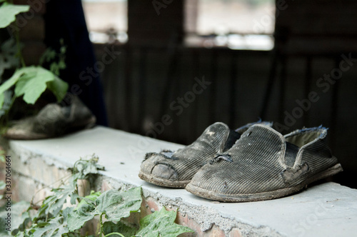old shoes on windowsill