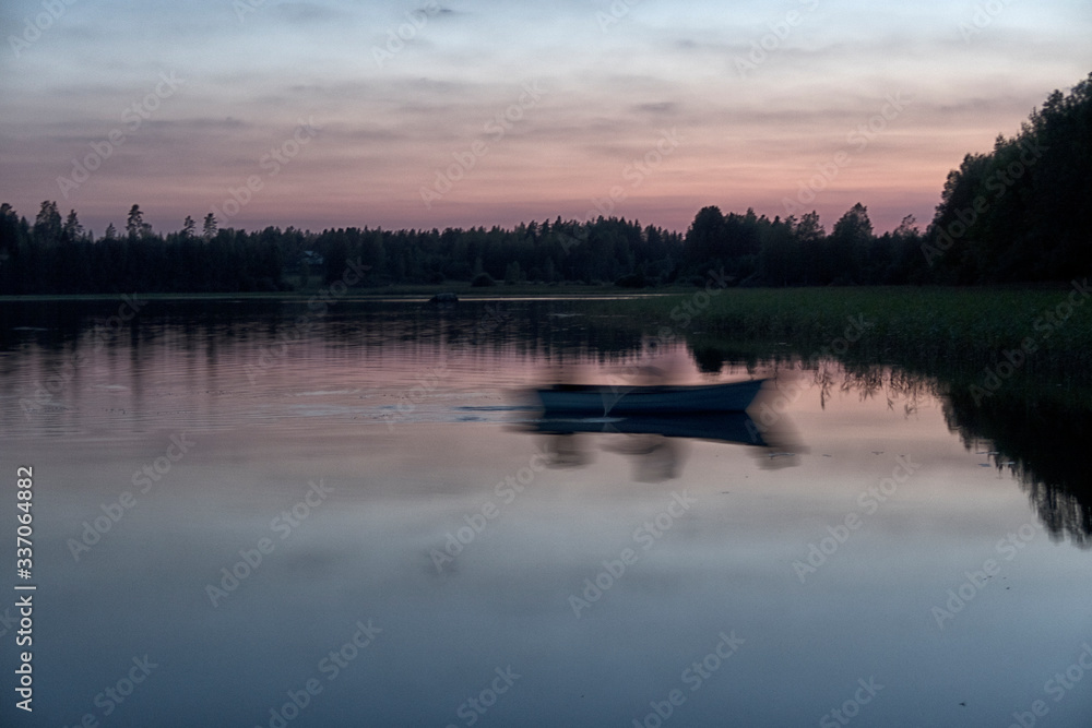 boat on the shore of a forest lake