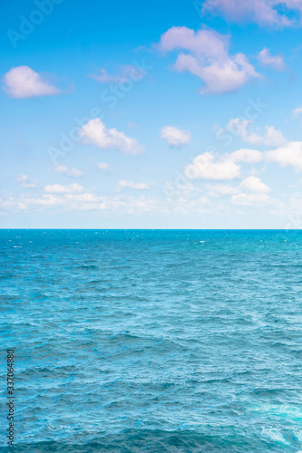 sea and sky. calm seascape with clouds on the evening sky. blue dreamy vacation background © Pellinni