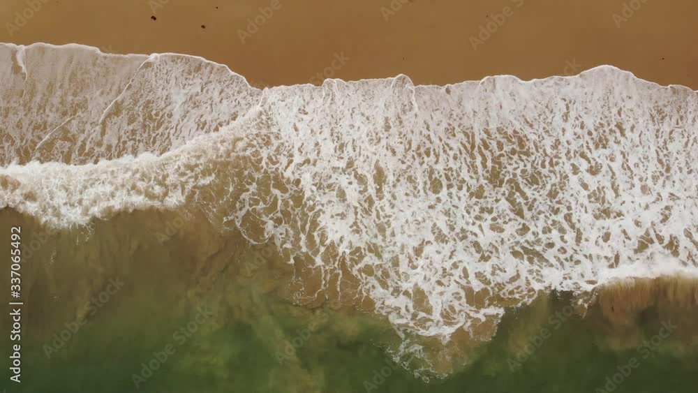 Aerial video from a drone of ocean waves that break on a sandy beach, a beautiful atlantic cost in the town of Dinard in the region of Brittany, France Aerial video from a drone of ocean waves that break on a sandy beach, a beautiful atlantic cost in the town of Dinard in the region of Brittany, France
