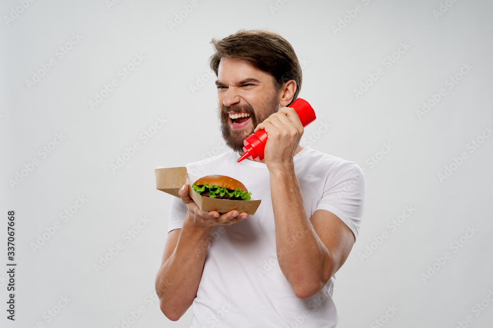 young man eating an apple young man eating an apple