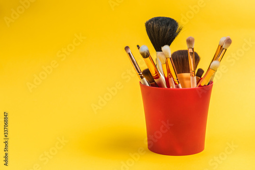 Different makeup brushes with place for text side view