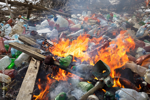 Spring flood and shore with garbage