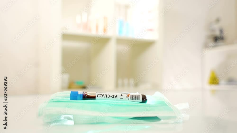 Red blood sample inside the tube for coronavirus sampling Red blood sample inside the tube for coronavirus sampling