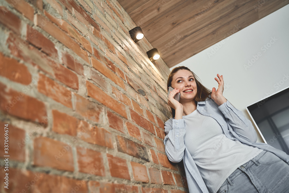Pretty lady talking on a mobile phone Pretty lady talking on a mobile phone