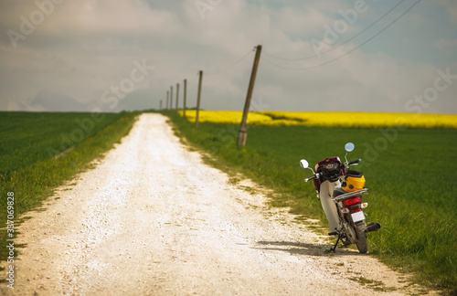 Fototapeta Naklejka Na Ścianę i Meble -  Motorcycle bike on empty country road, freedom of travel, active lifestyle
