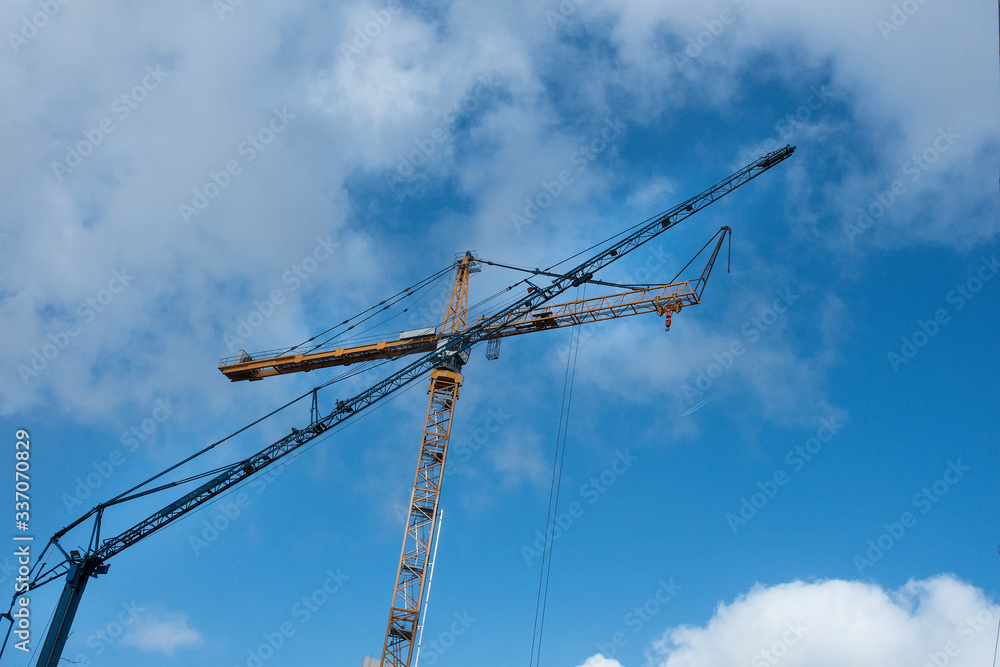 Construction site with tower crane for lifting building materials Construction site with tower crane for lifting building materials
