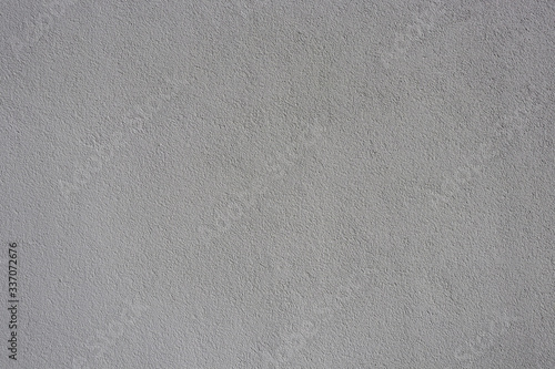 Texture of gray grungy paper. Uneven gray paper