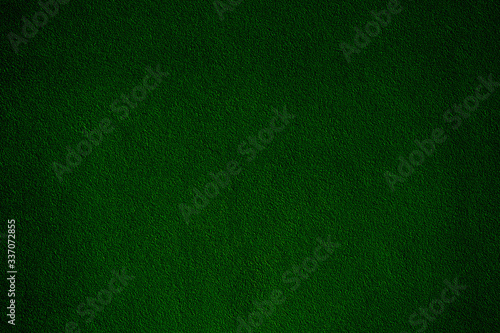 Dark green velvet fabric. Green shiny velvet fabric texture