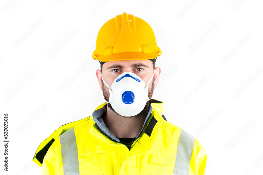 Young construction worker man wearing hard hat and medical mask. white background Young construction worker man wearing hard hat and medical mask. white background