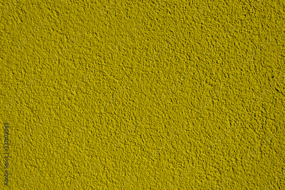 Naklejka premium Background of dark yellow wallpaper. The texture of dark yellow wallpaper. Mustard color background