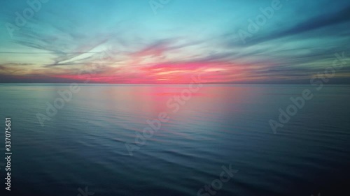Dron Flying Over Sea in a Beautiful Sunset. Aerial Drone Shoot. Sunrise Over the Sea. Colorful Sunset on the Baltic Sea, Latvia. 