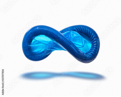 Flying blue condom with shadow.