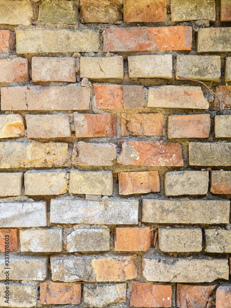 Fototapeta premium Background texture broken brick wall of an old house