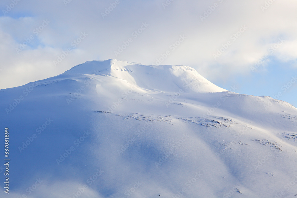 Beautiful snow capped mountains against the sky in Iceland