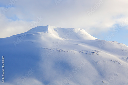 Beautiful snow capped mountains against the sky in Iceland © Kateryna