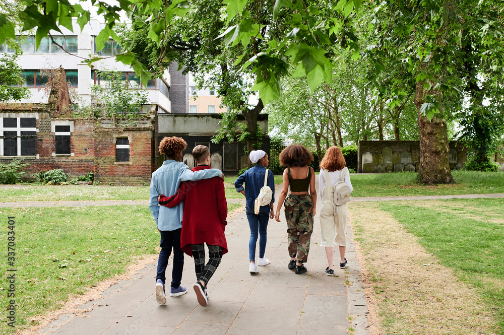 Teen group walking park. Teen group walking park.