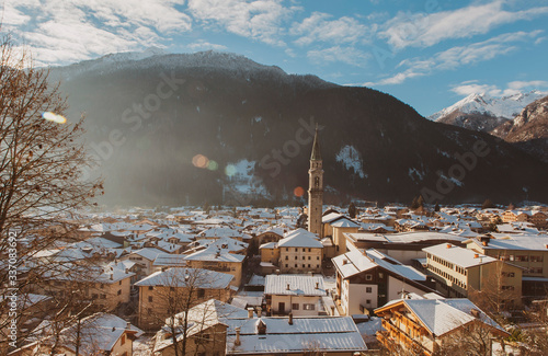 Nostalgic landscape of the alpine village of Pinzolo in winter.