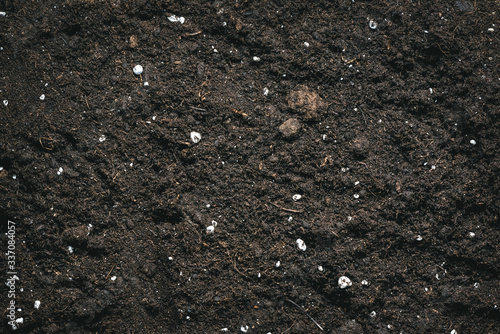 Fertilized garden soil texture background. photo