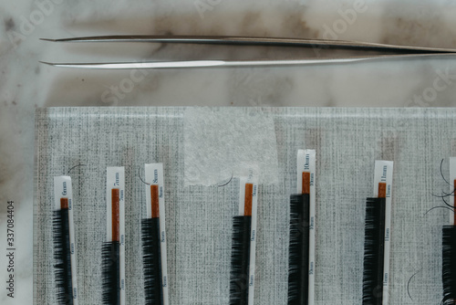 Process of a teenage girl having eyelash extensions put in photo