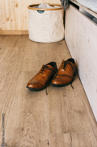 Male Leather Dress Shoes on Wooden Floor photo