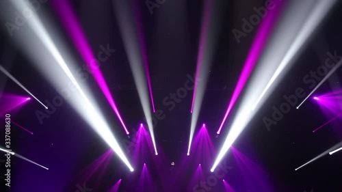 Stage Ray Of Light In Concert Hall. Lighting lamp rays shiny dynamic effect. Laser lights on the stage.  Professional lighting and show effects.Professional lighting and show effects.