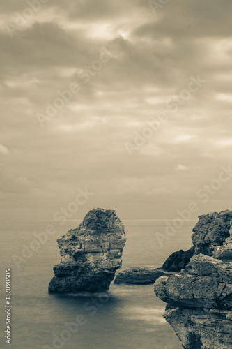 Long expoure image of the coastal cliffs of Tiulenovo resort in Bulgaria. Fine art vertical background image with blank space.2029