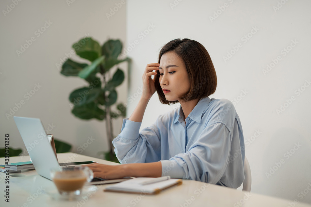 Young businesswoman is having problems with project in office. Young businesswoman is having problems with project in office.