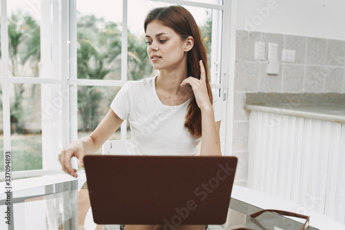 young business woman sitting at office desk