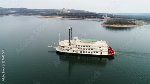 Ferry travels on Missouri lake, wide aerial photo