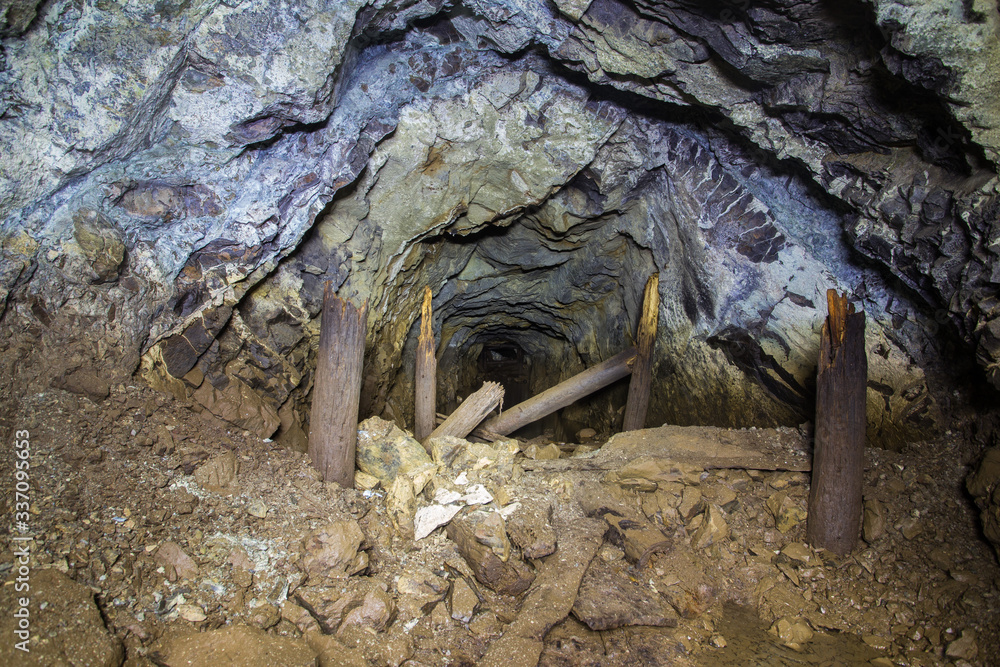 Underground abandoned platinum ore mine tunnel collapsed wooden timbering Underground abandoned platinum ore mine tunnel collapsed wooden timbering