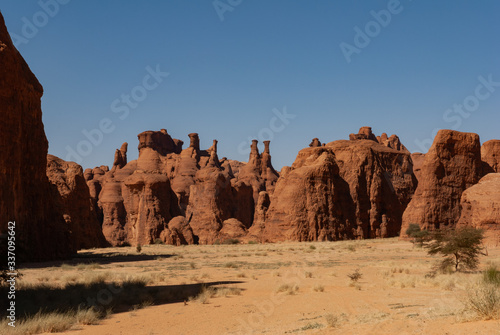 Sandstone pinnacles in the Sahara desert, blue sky, Chad, Africa